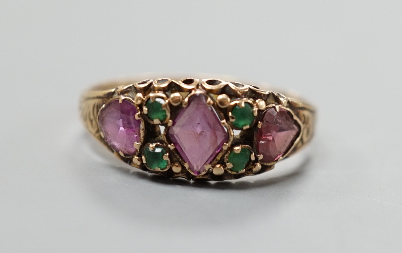 A Victorian gold, garnet? and emerald set half hoop ring, size N, gross weight 1.8 grams.